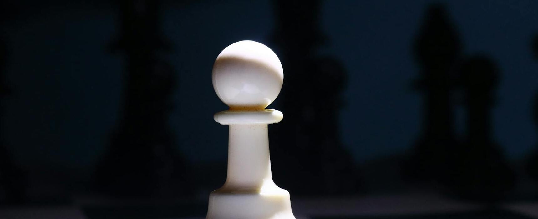 chess pawn piece to symbolise junior expatriate who needs a category 3 employment pass to work in Malaysia